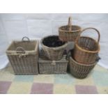A collection of wicker items including a picnic hamper, baskets, log bins, planter etc
