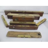 A collection of eight antique brass mounted spirit levels including Rabone, Thomas Bros.and