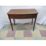 A early Victorian bow fronted side table with two drawers