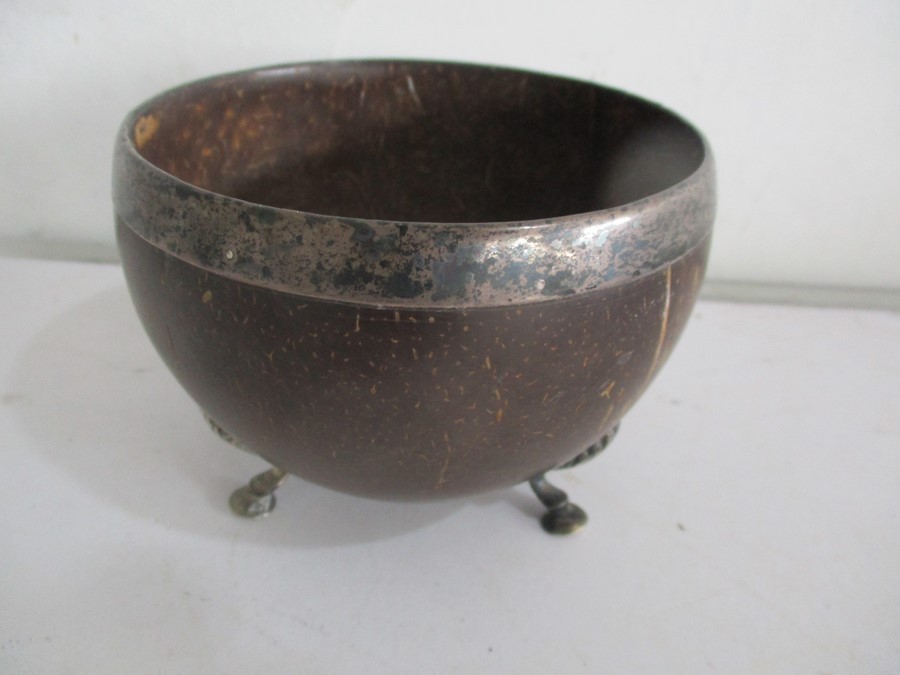 A Georgian "coconut bowl" with white metal rim on tripod feet