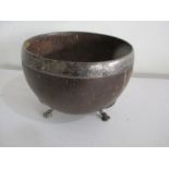 A Georgian "coconut bowl" with white metal rim on tripod feet