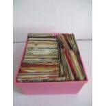 A collection of 7" single records including The Beatles, Fleetwood Mac, ELO, The Moody Blues, Neil