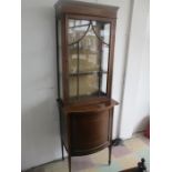 An Edwardian display cabinet with cupboard under A/F