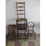 A oak occasion table on barley twist legs, along with three chairs