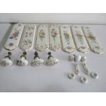 A collection of floral decorated door furniture including finger plates, handles etc.