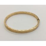 A 9ct gold hinged bracelet. Weight 11g