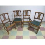 A set of four oak dining chairs - two missing seats