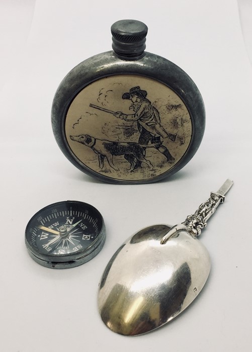 A pewter flask with inset panel depicting a hunting scene inscribed to base Josiah Ffitch & Co.