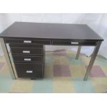 A contemporary desk with two drawers, with filing drawers under.
