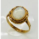 A 9 ct gold ring set with an opal