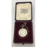 A cased continental silver fob watch with Roman numerals on decorated white enamel dial