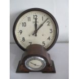 A Smiths bakelite wall clock ( converted to battery) along with a small oak cased Smiths mantle