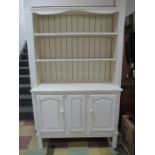 A painted dresser with cupboards under