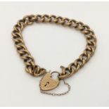 A 9ct gold curb bracelet with padlock. Weight 11.9g