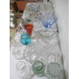 A collection of glassware including a Costa Boda vase, decanters, vases, paperweights, sand art