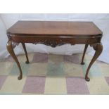 An Edwardian side table on cabriole legs of good proportion