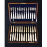 A cased set of hallmarked silver fruit knives and forks with mother of pearl handles.