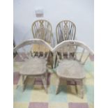 A pair of captains chairs and a pair of wheelback chairs