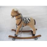 A child's rocking/pull along horse