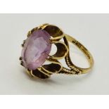 A 9 ct gold dress ring set with an amethyst