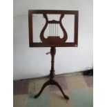 A reproduction adjustable music stand