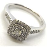 A 9ct white gold diamond cluster ring. Size L