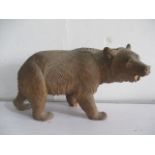 A Black Forest bear with glass eyes, approx 22cm length