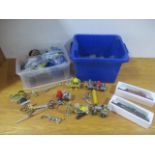 A collection of Meccano in the form of vehicles with loose and spare parts, along with two boxed