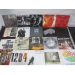 A collection of 7" vinyl singles including The Beatles, Robert Plant, The Jam, Free, Madonna,