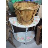 A painted half moon table along with a bamboo basket