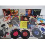 A collection of 7" vinyl singles including Rod Stewart, Whitney Houston, Duran Duran, Kylie Minogue,