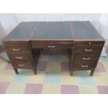 An Art Deco kneehole desk with leather top