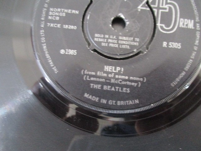 A collection of 7" vinyl singles including The Beatles, Robert Plant, The Jam, Free, Madonna, - Image 15 of 42