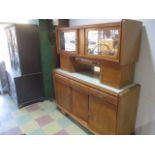 A French Art Deco kitchen unit with mirrored doors, drop down front with original glass containers