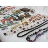 A collection of costume jewellery, including malachite, coral, compacts etc.
