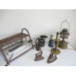 A collection of vintage blow torches, Tilley lamp, clay pigeon flinger, brass table lamp etc