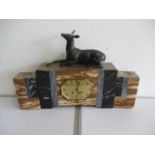 An Art Deco clock garniture featuring a deer atop the clock- key and pendulum in office