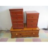 Two bedside cabinets, along with a pine TV cabinet