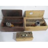 Two GPO hand stamp and date/letter plugs in wooden boxes- one named to Kilmington, Axminster, Devon
