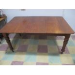 A Victorian mahogany extending dining table with 1 leaf - handle in office