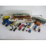 A collection of die cast vehicles including Matchbox, Lledo etc, along with a cased model ship.