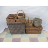 A quantity of wicker items including a laundry basket, picnic hamper, trays, carry basket etc