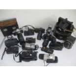 A collection of various cameras including Pentax, Canon, Praktica, Rolleicord etc