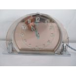 An Art Deco SEC electric clock with peach glass and chrome