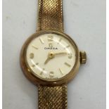 A ladies 9 ct gold Omega wristwatch on 9 ct strap- total weight 13.7g