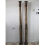 A pair of 19th century carved fluted mahogany pillars, height 2.4 metres