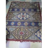 A red ground Kelim rug, approx 187 cm x 144 cm