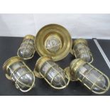 A set of five brass bulkhead ship lights stamped with Oceanic, along with one similar pendent