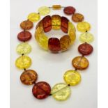 An amber fleck necklace and matching bracelet