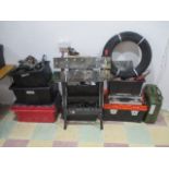 A collection of various tools and accessories including a work bench, jerry can, air sand blaster,